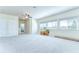Spacious bonus room features neutral carpets and three large windows at 1134 Tracey Ann Loop, Seffner, FL 33584