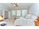 This main bedroom has an ensuite bathroom, ceiling fan, and plenty of natural light at 1134 Tracey Ann Loop, Seffner, FL 33584