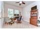 This carpeted office features natural light and a ceiling fan at 1134 Tracey Ann Loop, Seffner, FL 33584