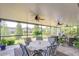 Covered patio includes ceiling fans and a nice view of the backyard at 1134 Tracey Ann Loop, Seffner, FL 33584