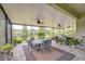 Covered outdoor living space with ceiling fans overlooking the backyard at 1134 Tracey Ann Loop, Seffner, FL 33584