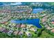 Panoramic aerial view of a Primary-planned community showcasing homes, lakes, and green spaces at 11624 Bristol Chase Dr, Tampa, FL 33626