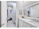 Bright bathroom with double sink vanity and an entry to the hallway at 11624 Bristol Chase Dr, Tampa, FL 33626
