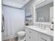 This bathroom features a white vanity, marble countertop, and shower/tub at 11624 Bristol Chase Dr, Tampa, FL 33626