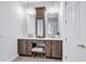 This bathroom features a double vanity, white countertop, and decorative tile wall at 11624 Bristol Chase Dr, Tampa, FL 33626