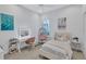 Cozy bedroom with a swing chair, makeup table and a comfortable bed at 11624 Bristol Chase Dr, Tampa, FL 33626