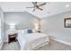 This bedroom features a queen bed, two side tables with lamps, and plush carpet at 11624 Bristol Chase Dr, Tampa, FL 33626