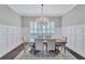 Formal dining room with hardwood floors, wainscoting and chandelier at 11624 Bristol Chase Dr, Tampa, FL 33626