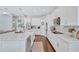 Spacious kitchen with white cabinetry, granite countertops, and stainless steel appliances at 11624 Bristol Chase Dr, Tampa, FL 33626