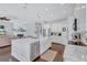Open-concept kitchen featuring granite countertops, modern appliances, and a breakfast bar at 11624 Bristol Chase Dr, Tampa, FL 33626
