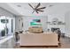 Cozy living room featuring hardwood floors, a fireplace and sliding glass doors to the outside patio at 11624 Bristol Chase Dr, Tampa, FL 33626