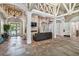 Inviting lobby with high ceilings, a stone fireplace, comfortable seating, and stylish tile flooring at 11624 Bristol Chase Dr, Tampa, FL 33626