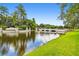 Scenic view of the Waterchase community entrance, featuring a bridge and lush landscaping at 11624 Bristol Chase Dr, Tampa, FL 33626