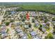 An aerial view of a property nestled in a residential community with lush greenery at 12062 Stone Crossing Cir, Tampa, FL 33635
