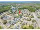 Aerial view of a property in a community near a body of water and surrounded by mature trees at 12062 Stone Crossing Cir, Tampa, FL 33635