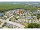 Aerial of a property in a residential community with mature trees, and lush landscaping at 12062 Stone Crossing Cir, Tampa, FL 33635