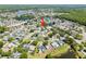 An aerial view of a property in a residential community with lakes and lush greenery nearby at 12062 Stone Crossing Cir, Tampa, FL 33635