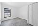 Clean bedroom with tile floor, closet, and a window at 12062 Stone Crossing Cir, Tampa, FL 33635