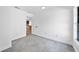 This bedroom features white walls, trim and door with modern gray tile, creating a clean and contemporary space at 12062 Stone Crossing Cir, Tampa, FL 33635