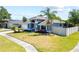 Beautiful single-story home with manicured lawn and a white privacy fence at 12062 Stone Crossing Cir, Tampa, FL 33635