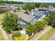 Corner lot showcasing a screened-in pool and lush landscaping, surrounded by a privacy fence and mature trees at 12062 Stone Crossing Cir, Tampa, FL 33635