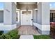 Inviting front entryway with double doors, decorative accents, and stylish tile flooring at 12062 Stone Crossing Cir, Tampa, FL 33635