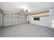 Spacious garage features epoxy flooring, ample storage, and an automatic door at 12062 Stone Crossing Cir, Tampa, FL 33635