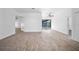 Spacious living room with hardwood floors, neutral walls, and a view of the outdoor pool area at 12062 Stone Crossing Cir, Tampa, FL 33635