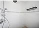 Elegant walk-in shower with white subway tile and a modern rainfall showerhead at 12062 Stone Crossing Cir, Tampa, FL 33635