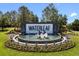 Waterleaf community entrance showcasing a beautiful water feature, elegant signage, and manicured landscaping at 13227 Waterleaf Garden Cir, Riverview, FL 33579