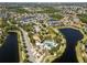 An aerial view of community featuring a pool, playground, and scenic lake views at 13227 Waterleaf Garden Cir, Riverview, FL 33579