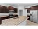 Well-equipped kitchen showcasing granite countertops and modern stainless steel appliances at 13227 Waterleaf Garden Cir, Riverview, FL 33579