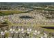 This aerial view features houses surrounding ponds within the community at 13227 Waterleaf Garden Cir, Riverview, FL 33579