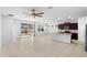 Open-concept living space adjacent to the kitchen with abundant natural light at 13227 Waterleaf Garden Cir, Riverview, FL 33579