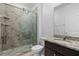 Bathroom featuring a glass-enclosed shower, granite vanity, and modern fixtures at 13227 Waterleaf Garden Cir, Riverview, FL 33579