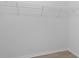 Walk-in closet with white wire shelving, perfect for organization and storage at 13227 Waterleaf Garden Cir, Riverview, FL 33579