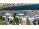 A picturesque aerial view of a home by the lake with mature landscaping and backyard privacy at 13651 Ashlar Slate Pl, Riverview, FL 33579