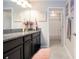 Bathroom featuring double vanity with granite counters and views of the shower/toilet room at 13651 Ashlar Slate Pl, Riverview, FL 33579