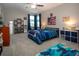 Spacious bedroom with a ceiling fan and windows with curtains at 13651 Ashlar Slate Pl, Riverview, FL 33579