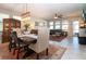 Dining room and living room featuring stylish decor, natural light and an open concept at 13651 Ashlar Slate Pl, Riverview, FL 33579
