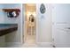 Entryway featuring a granite counter, hats, and view into the pedestal sink powder room at 13651 Ashlar Slate Pl, Riverview, FL 33579