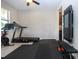Home gym with workout equipment, rubber floor mats, and natural light, perfect for fitness enthusiasts at 13651 Ashlar Slate Pl, Riverview, FL 33579
