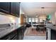 Granite countertops in kitchen with view of dining and living area at 13651 Ashlar Slate Pl, Riverview, FL 33579