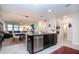 Open kitchen featuring a central island, seamlessly connecting to the dining and living areas at 13651 Ashlar Slate Pl, Riverview, FL 33579