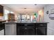 Contemporary kitchen with stainless steel appliances and a large island, ideal for meal preparation at 13651 Ashlar Slate Pl, Riverview, FL 33579