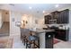 Kitchen with island, black cabinets, and stainless steel appliances at 13651 Ashlar Slate Pl, Riverview, FL 33579