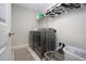 Laundry room equipped with a modern washer and dryer at 13651 Ashlar Slate Pl, Riverview, FL 33579