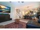 Open-concept living room showcasing media display, staircase, dining room, and kitchen at 13651 Ashlar Slate Pl, Riverview, FL 33579