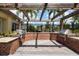Brick outdoor grill area with two built-in stainless steel grills, perfect for barbecues and entertaining at 13651 Ashlar Slate Pl, Riverview, FL 33579