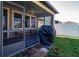 Covered patio with comfortable seating and backyard view at 13651 Ashlar Slate Pl, Riverview, FL 33579
